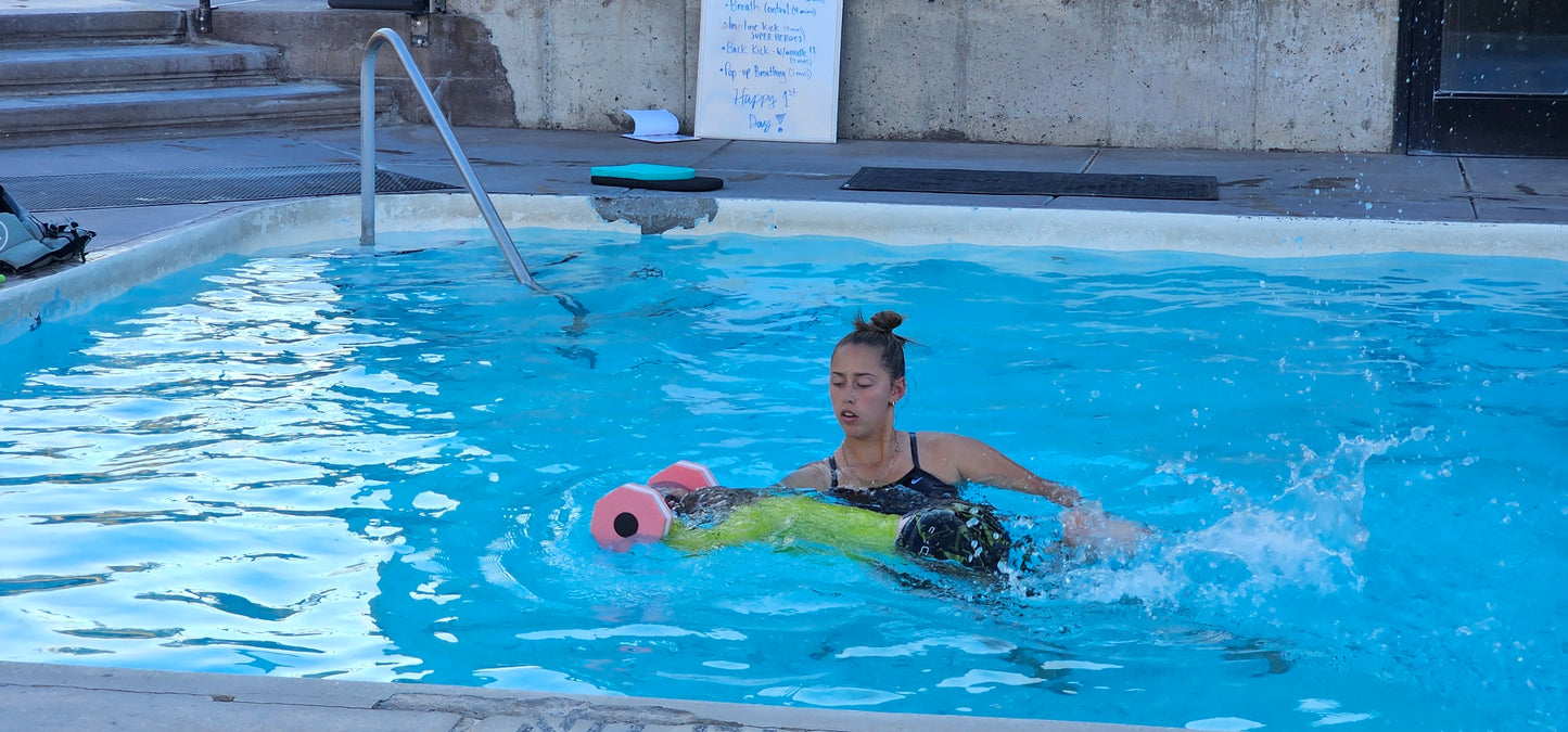Broadwater swim instructor teaching a 6 year old to swim
